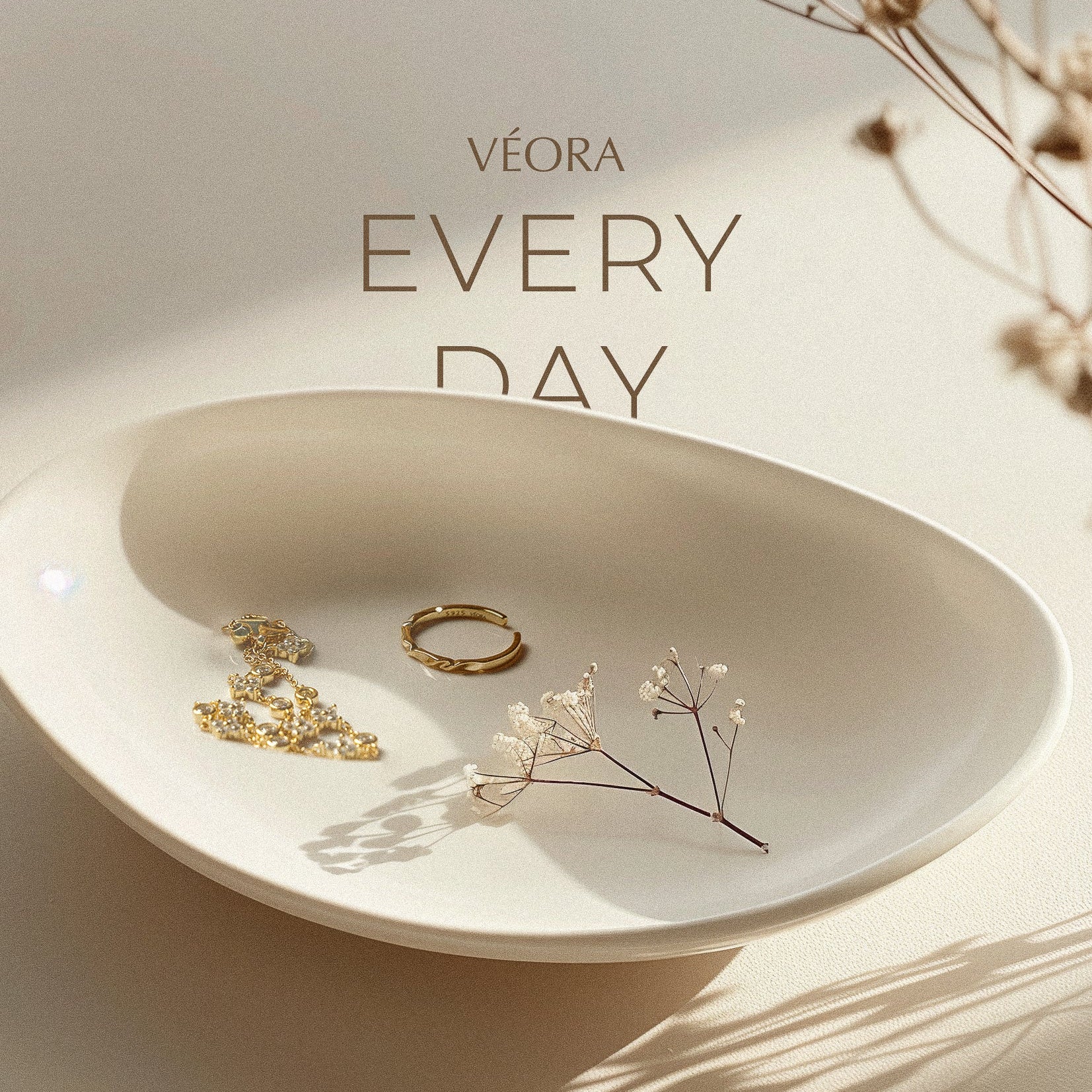 VÉORA, Swiss jewelry brand, 18k gold plated, 925 sterling silver, luxury aesthetic, timeless elegance, minimal chic, high fashion, beige neutral tones, natural warm light, elegant feminine style, premium quality, modern classic, soft studio lighting, delicate details, luxury Swiss design, fine jewelry, refined craftsmanship, elegant simplicity
